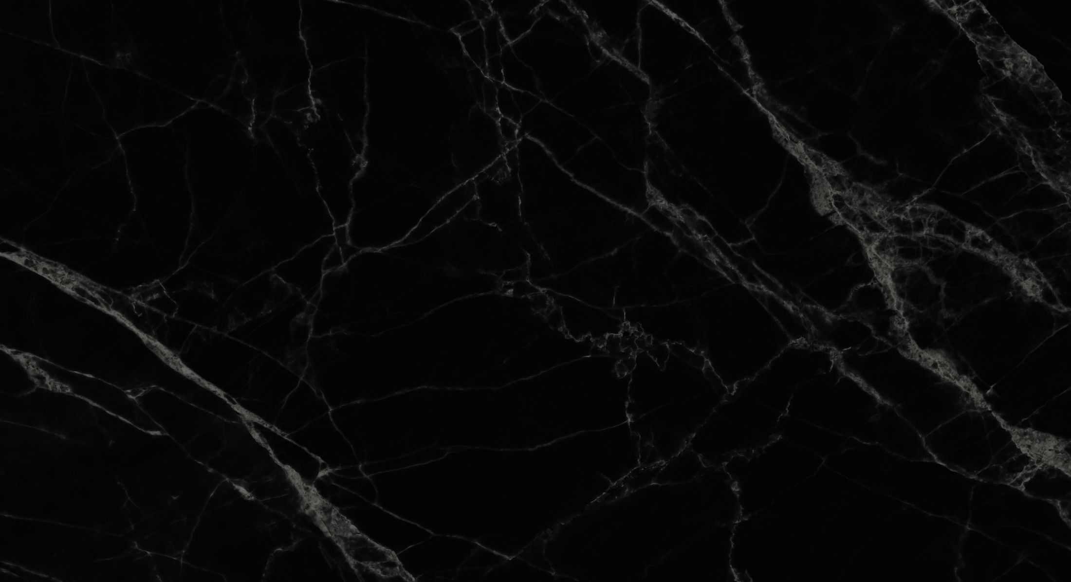 Black marble texture with white veining patterns