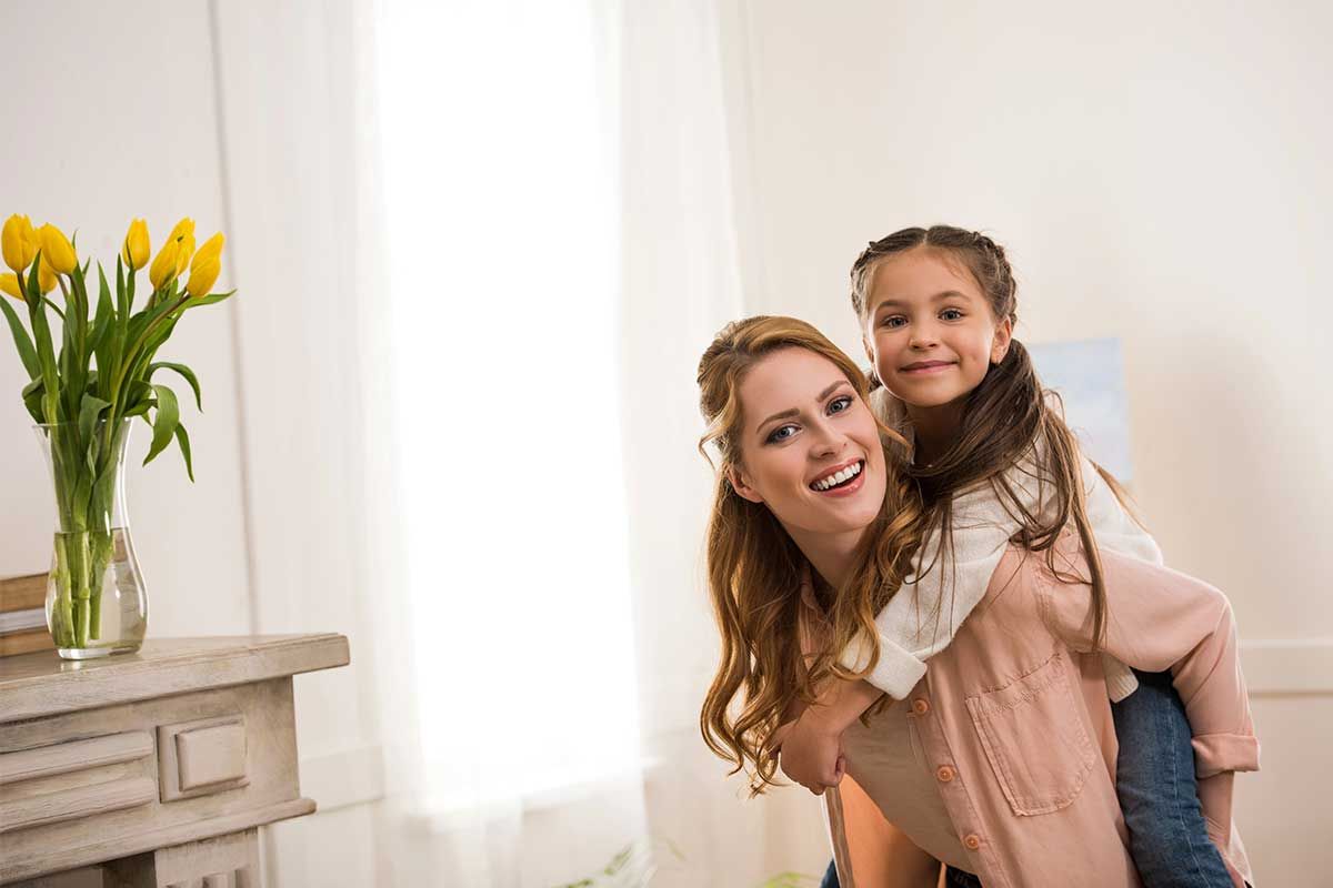 Mother and daughter sharing a joyful moment.