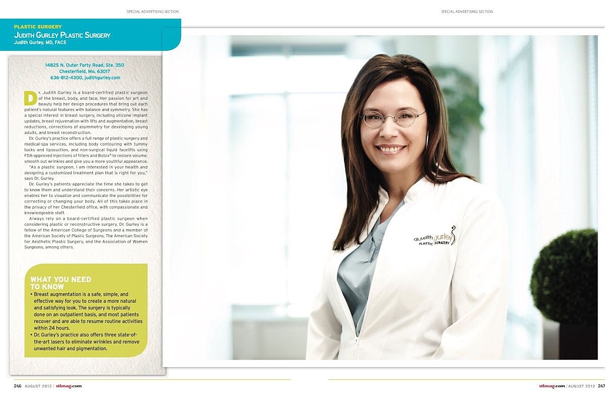 Plastic surgeon smiling in professional attire.