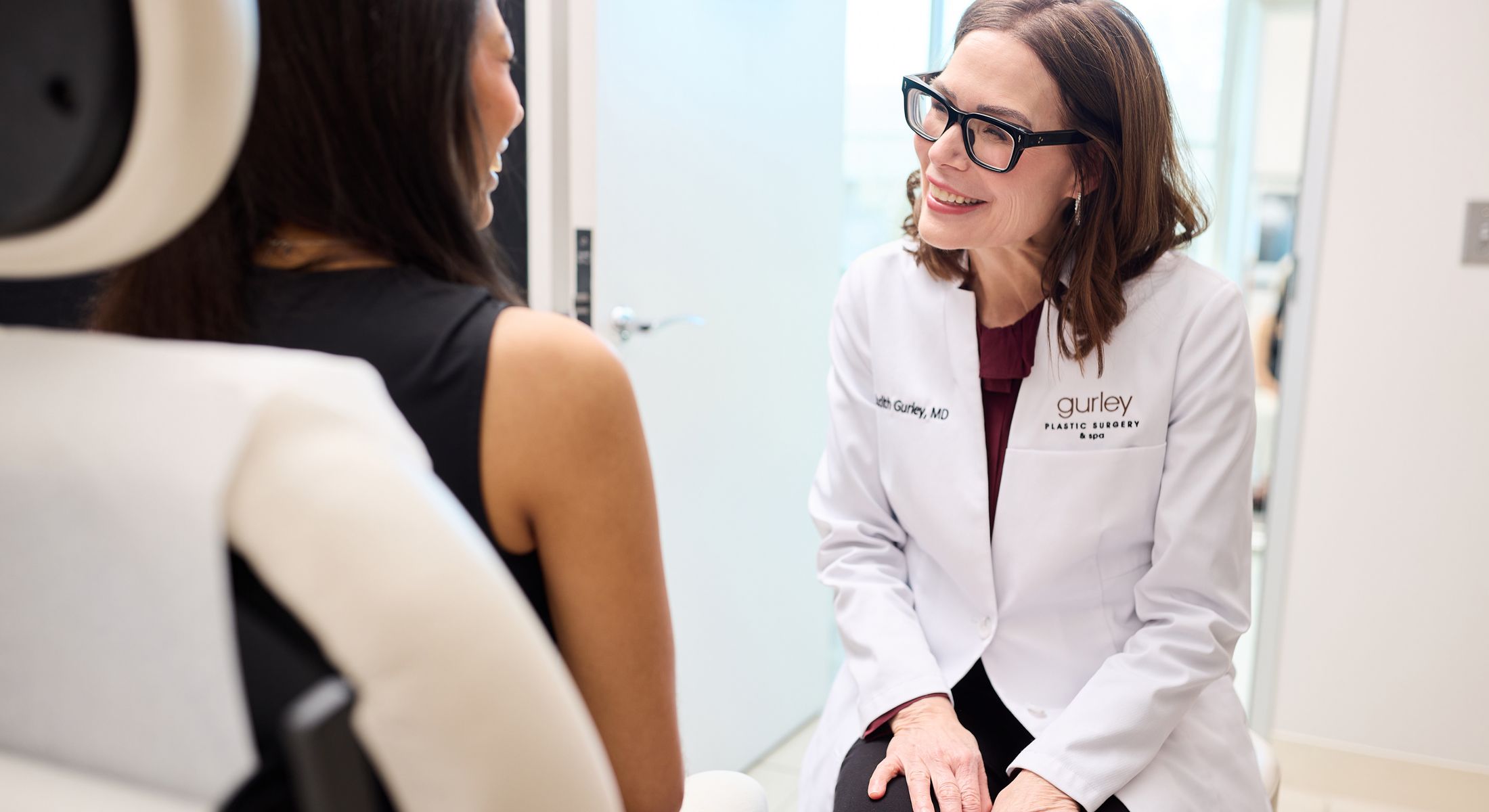 Doctor consulting with patient in modern office.